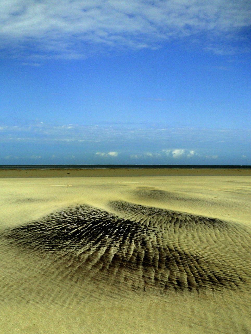 Sandgemälde bei Ebbe